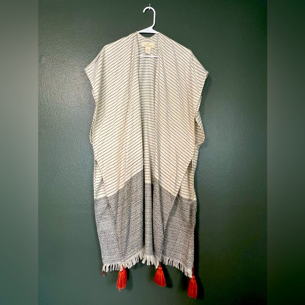 Shawl style vest with tassels. One size. Good condition.